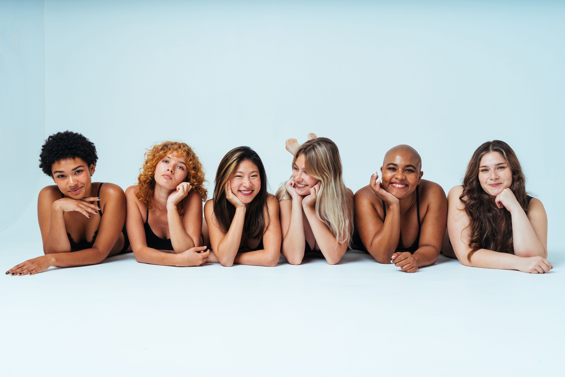 Multiethnic group of women wearing underwear with diverse kind of bodies