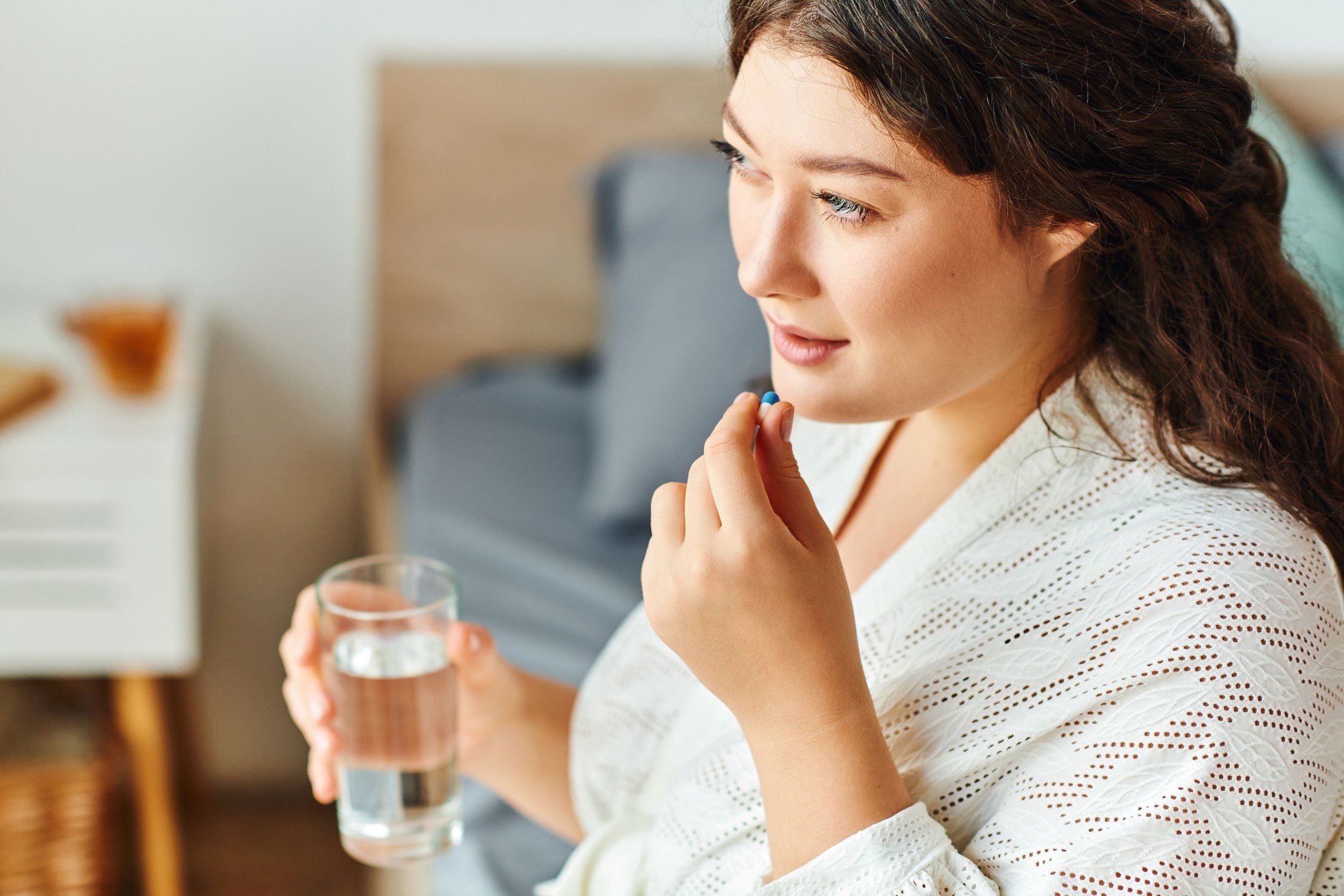 A beautiful plus size woman takes a wellness moment while enjoying her morning routine at home