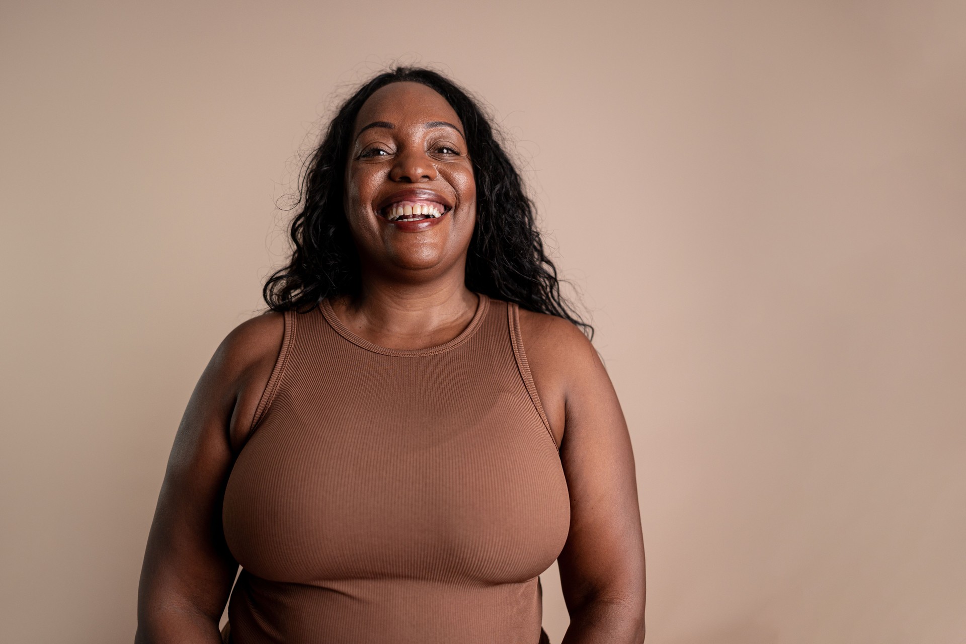 Portrait of a mature woman on a beige background